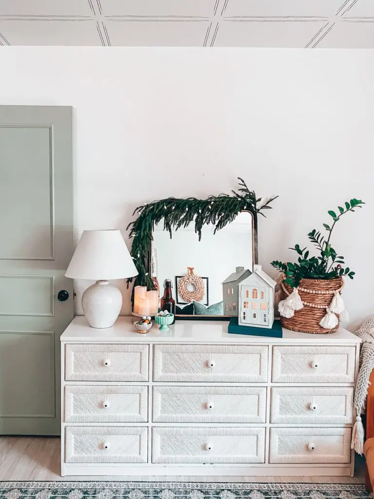 dresser with Christmas decorations on it