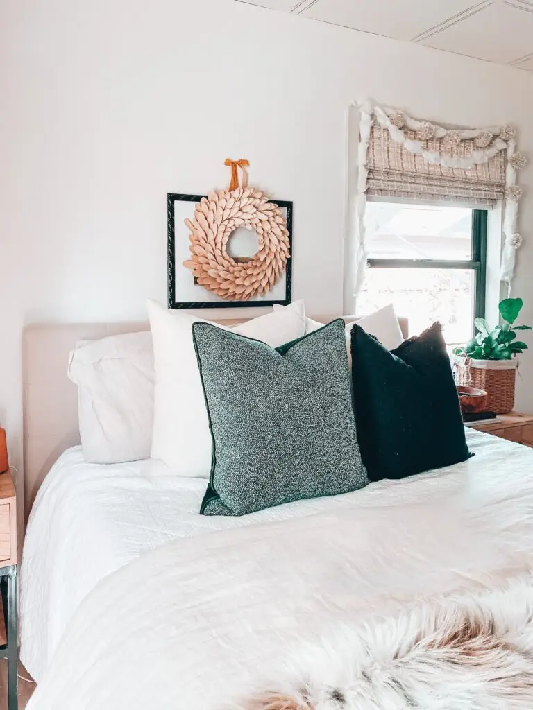 Bedroom with Christmas wreath on wall