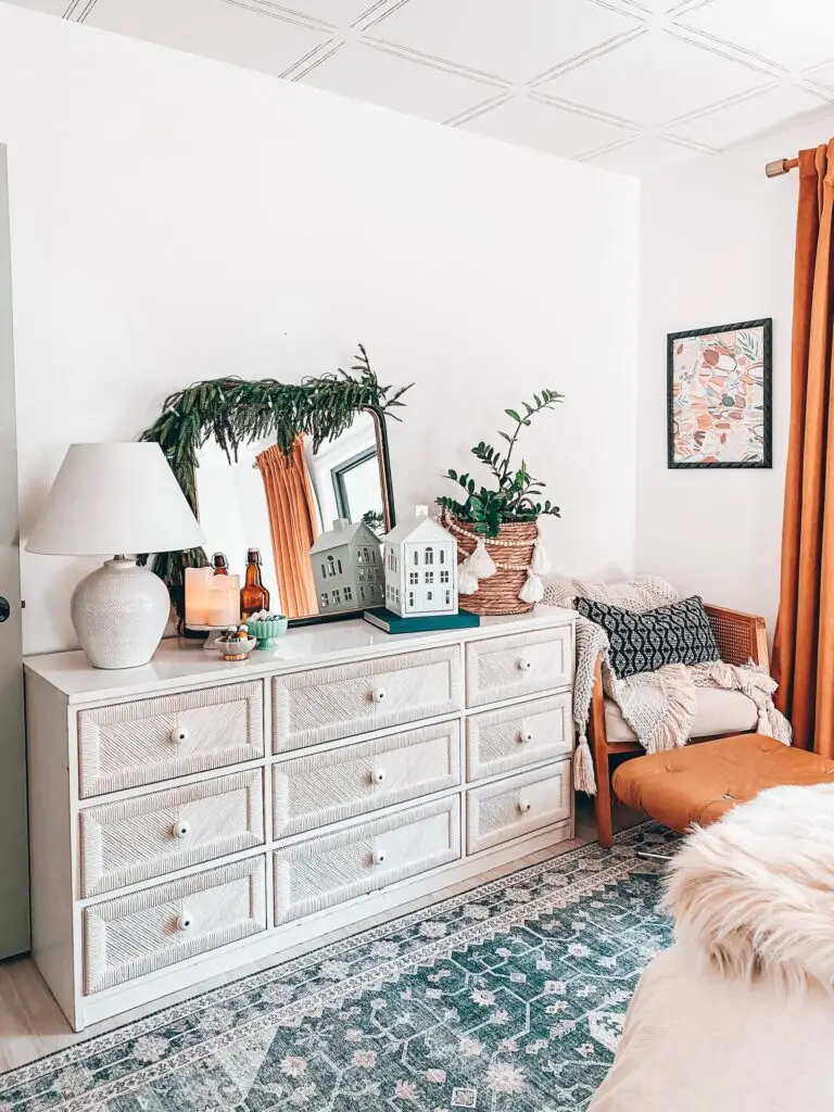 dresser with Christmas decorations on it