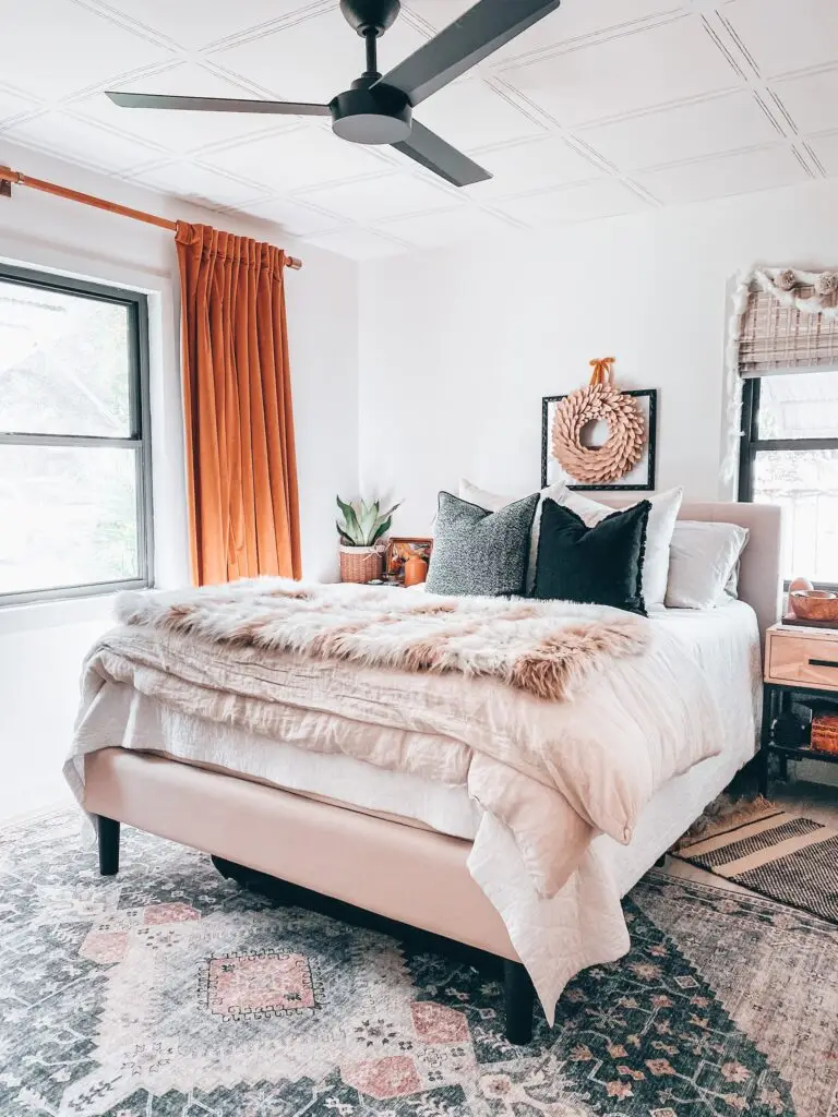 Bedroom with Christmas wreath on wall