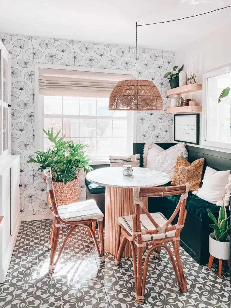 dining nook with floral wallpaper and hanging light and floating shelves