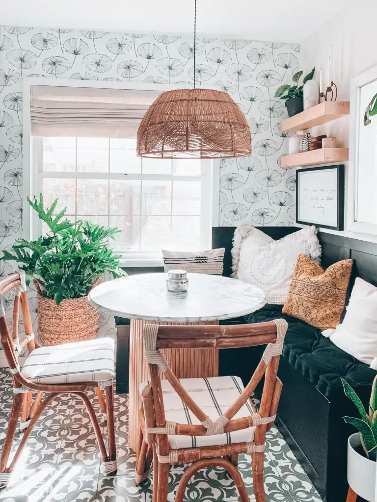 dining nook with floral wallpaper and hanging light and floating shelves