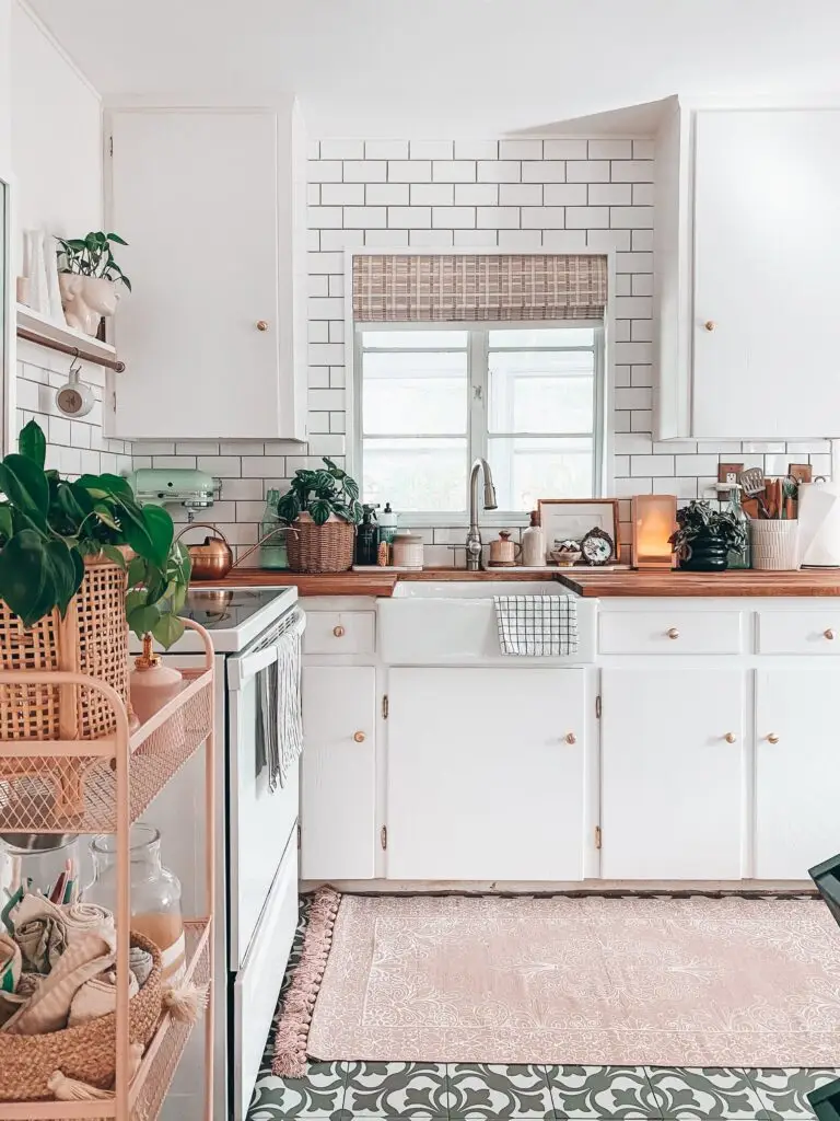 white bright kitchen warm with butcher block counters and farmhouse sink