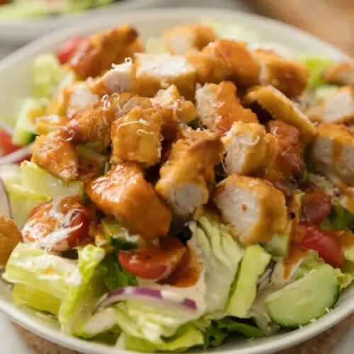 chopped chicken over lettuce