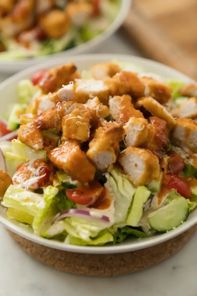 chopped chicken over lettuce